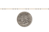 Gold-filled + sterling silver chain next to a U.S. quarter dollar coin for scale